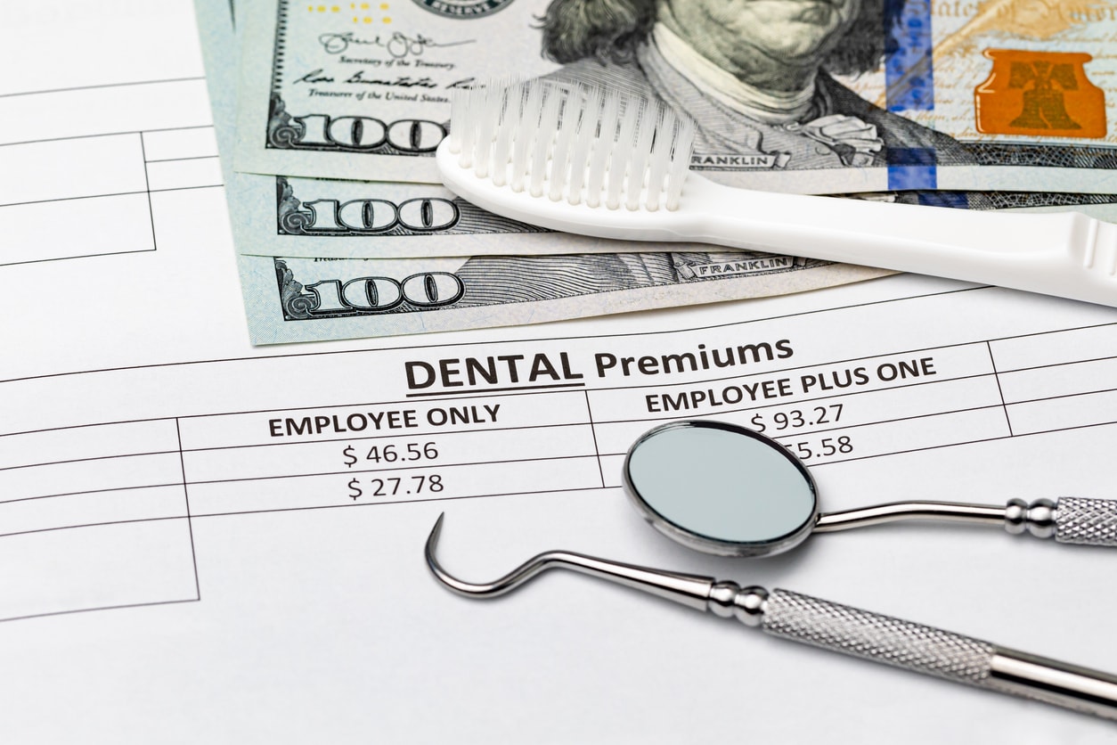 dental insurance bill with toothbrush and dental tools. concept of oral health, exam and teeth cleaning