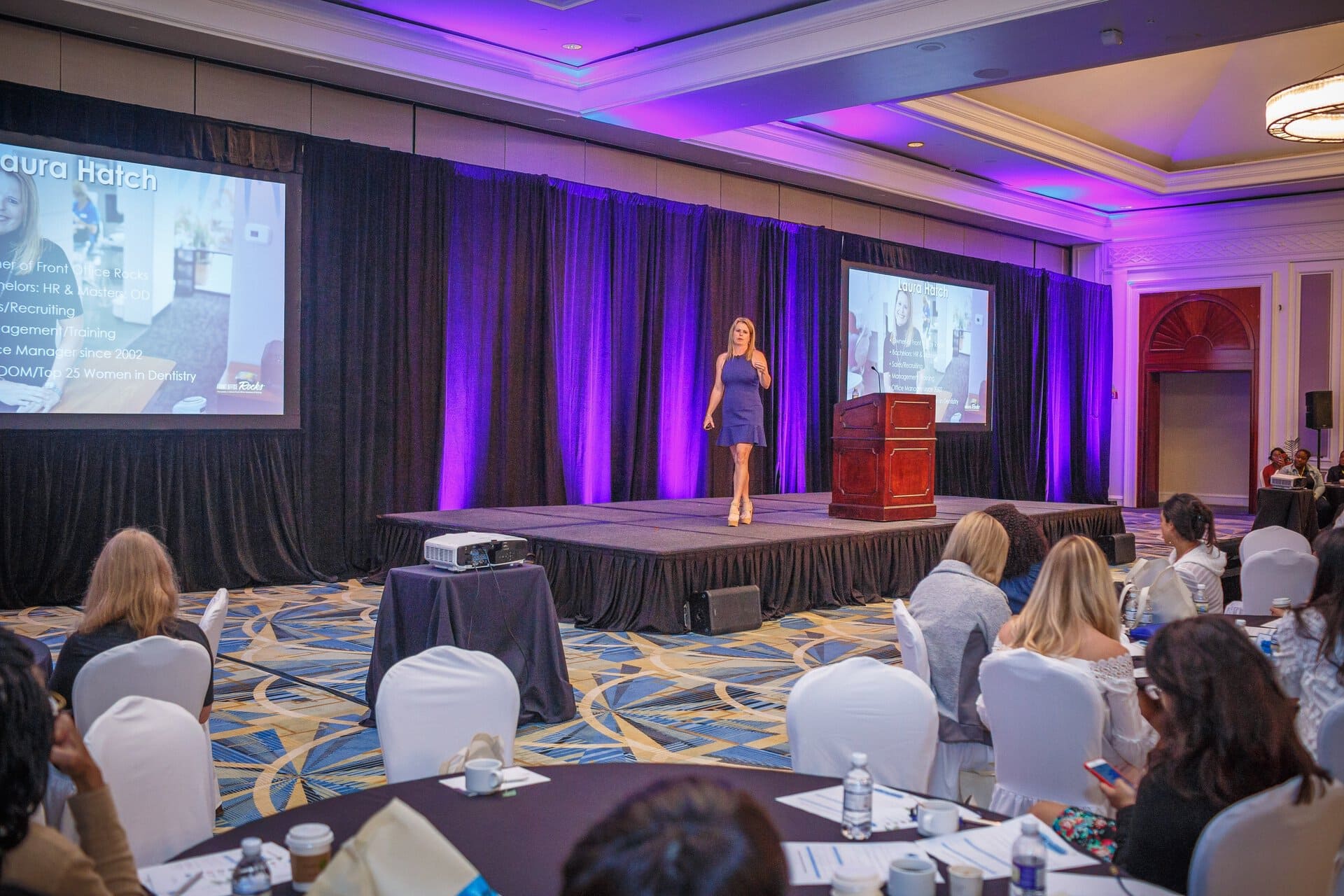 Laura Nelson speaking at a dental conference