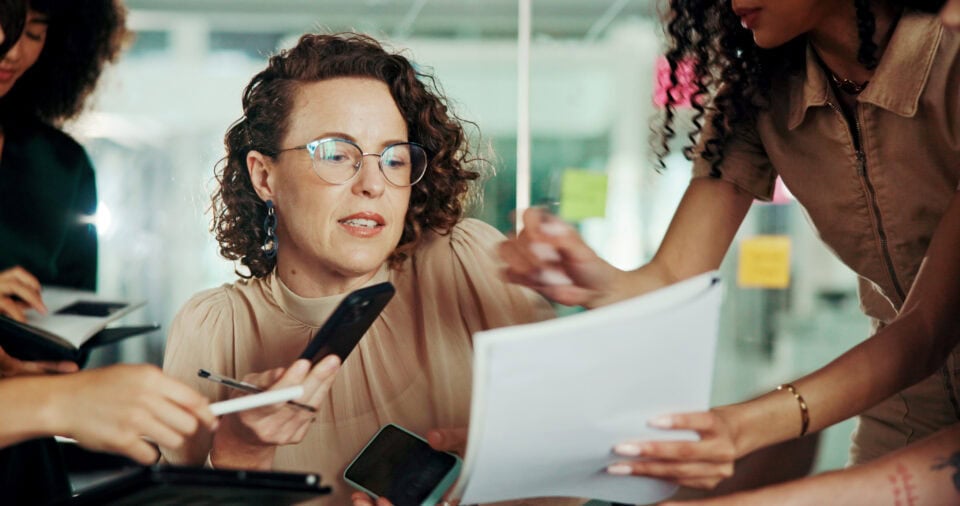 time management documents multitasking with business woman deadline meeting paperwork group team collaboration with people office proposal leader policy review